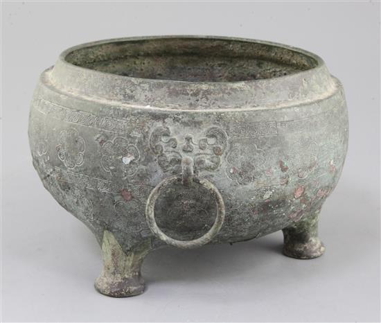 A Chinese archaic bronze tripod vessel base, Dui, Eastern Zhou dynasty, 6th-5th century B.C., 25cm wide, 15cm high, hole, lacking cover